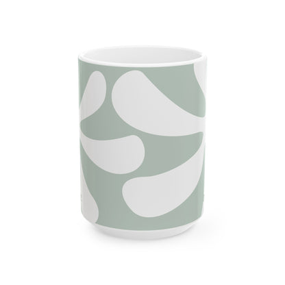 A white ceramic 15oz mug featuring a minimalist, abstract organic pattern in sage green and white, set against a clean white background. Handle not visible.