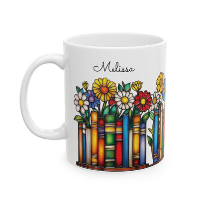 A white ceramic 11oz mug featuring a colorful illustration of flowers growing out of book spines, with the name 'Melissa' printed in black script above the design, on a plain white background. Left handle view.