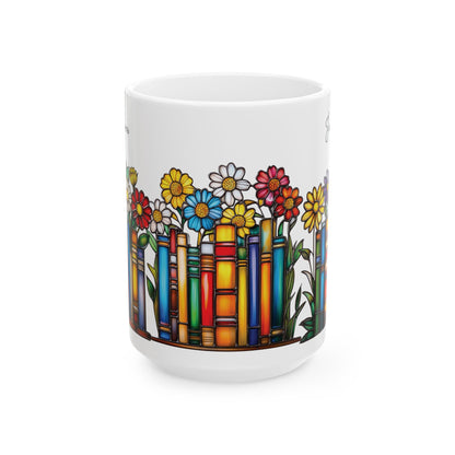 A white ceramic 15oz mug featuring a colorful illustration of flowers growing out of book spines, on a plain white background. No handle view.