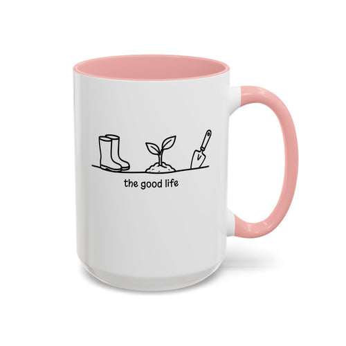 White accent mug with pink interior, 'the good life' quote and garden tool line art, 15oz right side view.
