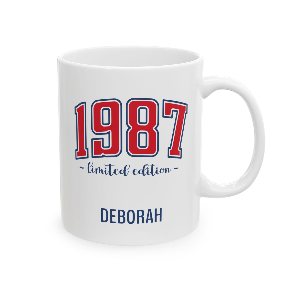 A white ceramic 11oz mug with '1987' printed in red and blue varsity-style numbers, 'limited edition' in blue script, and the name 'DEBORAH' in blue at the bottom. Right handle view.
