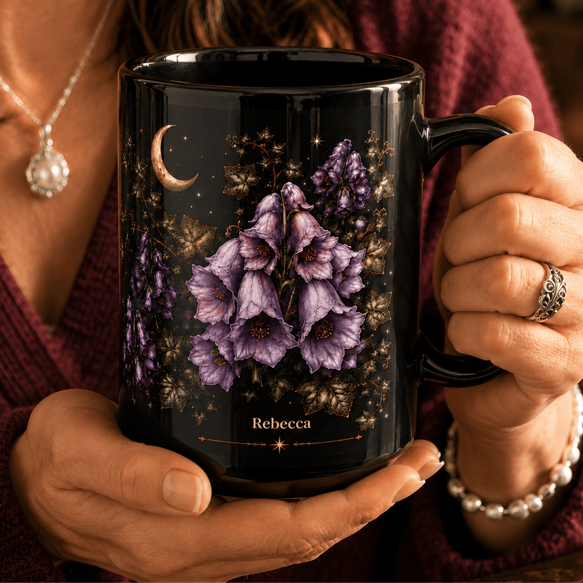 Woman holding a personalized Wolfsbane moonlit Halloween black mug